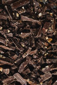 A detailed view of broken chocolate pieces showcasing texture and indulgence.